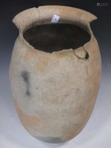 A Chinese pottery vase, incised surface, possibly early Neolithic, 36cm high