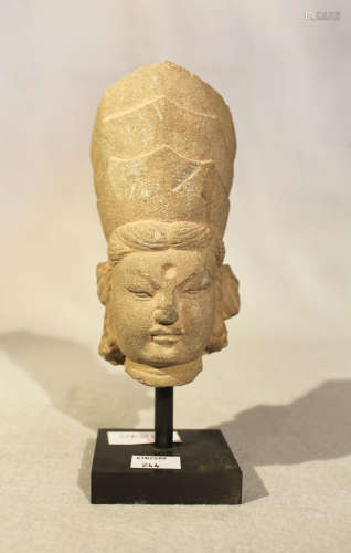 A Chinese grey stone head of a Bodhisattva with three crowns, in Tang Dynasty style, 14.5cm high