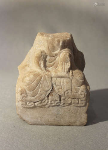 A Chinese white marble Seated figure of Guanyin, within an aureole, in 6th/7th century style, 13.5cm