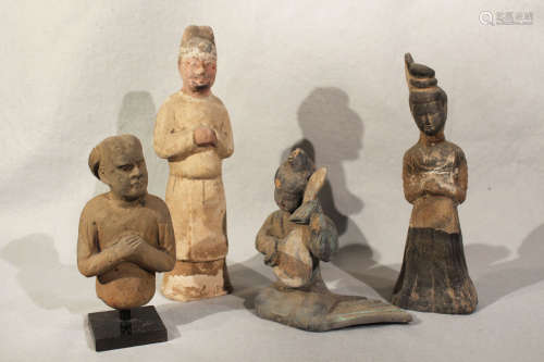A group of four Chinese painted pottery figures and half figures, perhaps Han Dynasty and later,