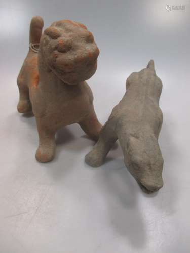 A Chinese grey pottery prowling dog and a red pottery chimera, both probably Han Dynasty (206 BC -