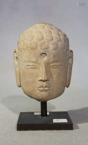 A Chinese pale cream stone head of Buddha, 11cm high