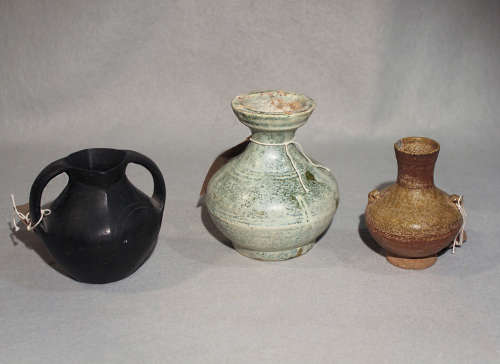 A Chinese green glazed small Hu jar, Han Dynasty (206 BC - 221 AD),13.8 cm high; a black pottery