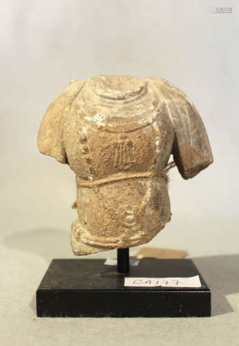 A Chinese grey stone fragmentary torso of Avalokitesvara, in 6th/7th century style, 11cm high