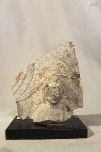 A Chinese grey limestone stele fragment with Buddhist deity, in Wei Dynasty style, 15cm high