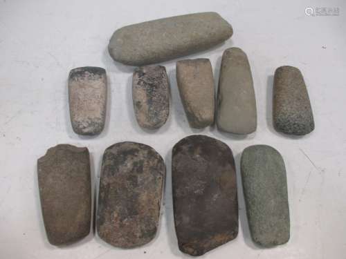 A collection of Neolithic axe heads in a box