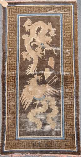 A woollen rug, possibly Chinese with a dragon and phoenix 148 x 75cm; two other Chinese geometric
