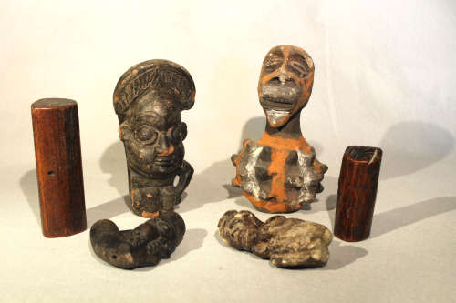 A group of African pottery including Cameroon items, comprising two smoking pipes, 18cm and 10 cm