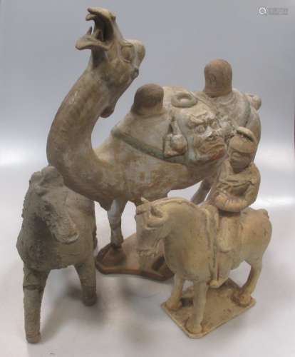 A group of three Chinese pottery models, a Bactrian camel, Han type, 40cm high; and a rider on horse