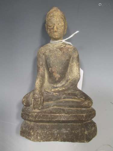 A Thai carved soft-stone Buddha, seated in meditation, on a chamfered integral base, 19th/20th