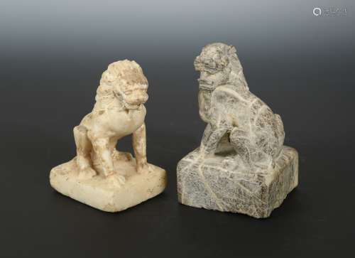 A Chinese carved white marble seated lion, in Sui Dynasty style, 13.5cm, another, larger, in