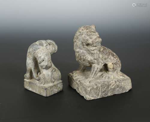 A Chinese greystone carving of two fighting Fo-Dogs, in archaic style,12cm high: and a veined