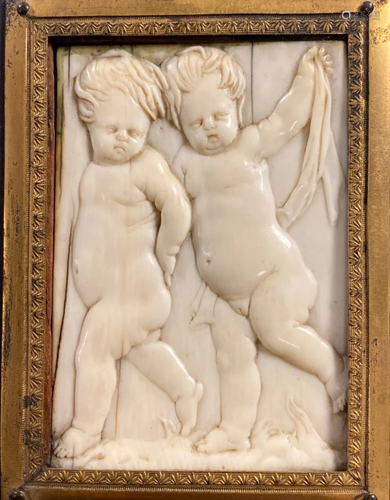 Early Carved Bone Plaque of Putti Figures