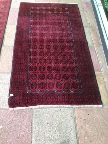 AN AFGHAN RUG/CARPET 207 X 101CM