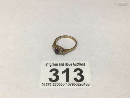 A 9CT GOLD RING WITH 12 DIAMONDS AND AMETHYST SET IN 9CT GOLD SIZE N 2 GRAMS