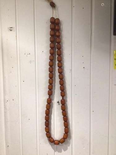 A LARGE BUTTERSCOTCH SET OF AMBER BEADS AS A NECKLACE COMPRISES OF 44 BEADS 3 X 2.5 CM WITH 2