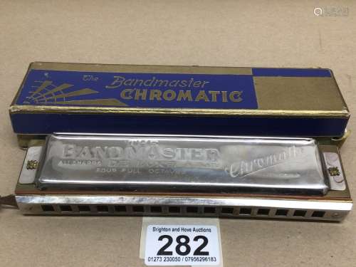 AN ORIGINAL BOXED VINTAGE GERMAN HARMONICA (THE BANDMASTER CHROMATIC DELUXE)