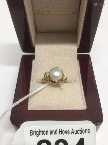 A MARKED 14CT GOLD RING WITH A SEEDED PEARL SIZE K 2 GRAMS TOTAL WEIGHT