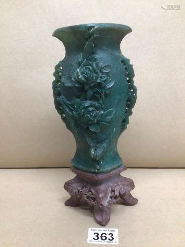 A CARVED PIECE OF CHINESE JADITE ON STAND A/F 25CM