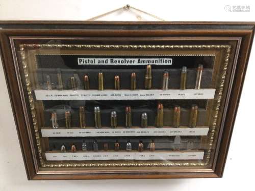 FRAMED AND GLAZED COLLECTION OF PISTOL AND REVOLVER AMMUNITION 37 X 29CM