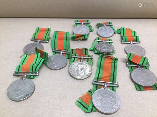 A QUANTITY OF 1939-1945 DEFENCE MEDALS WITH RIBBONS