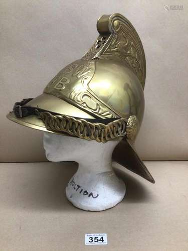 A BRASS REPRODUCTION FIREFIGHTER'S HELMET FOR THE NEW SOUTH WALES FIRE BRIGADE AUSTRAILIA WITH