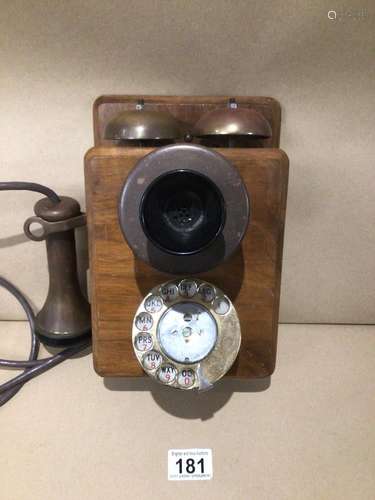 AN ANTIQUE BELSET TELEPHONE WITH A BRONZE BAKELITE EAR AND MOUTH PIECE