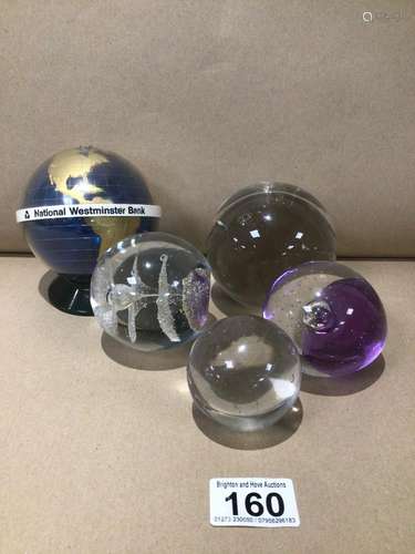 A VINTAGE NATWEST GLOBE MONEY BOX WITH THREE GLASS PAPERWEIGHTS