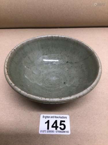 A CHINESE PORCELIAN CELADON BOWL A/F 12CM DIAMETER