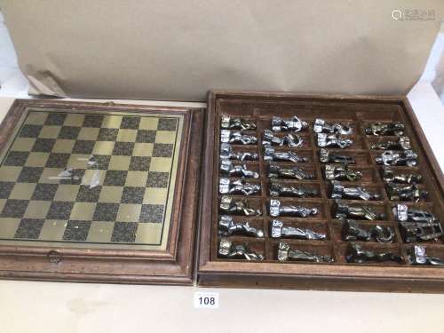 A CHESS SET MADE UP WITH WEIGHTED HEAVY METAL FIGURES