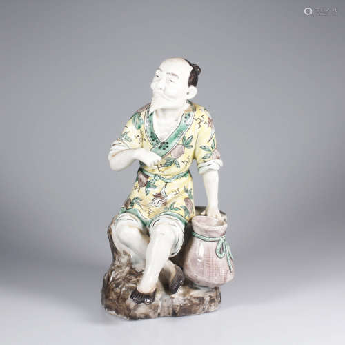 A PLAIN SANCAI PORCELAIN FISHERMAN STATUE