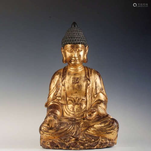 A GOLD LACQUERED WOOD BUDDHA STATUE