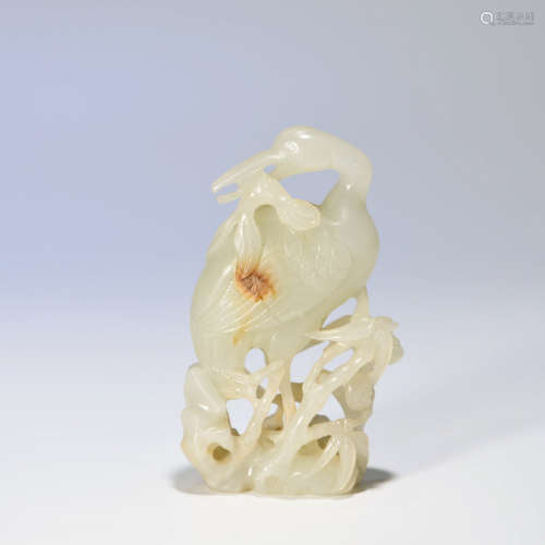 A HETIAN JADE CARVED RED-CROWNED CRANE ORNAMENT
