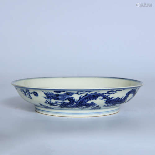 A BLUE WHITE DRAGON CARVED PORCELAIN PLATE