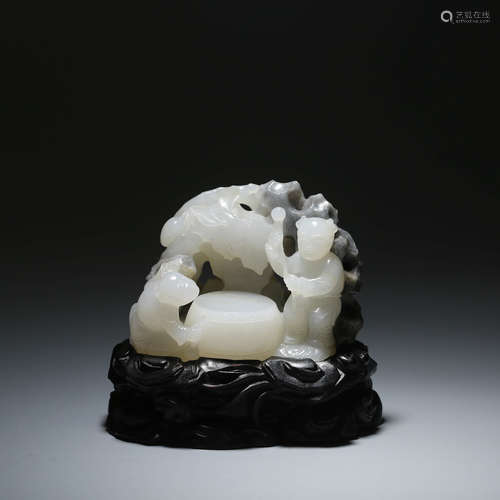 A BLACK AND WHITE JADE CARVED BOY