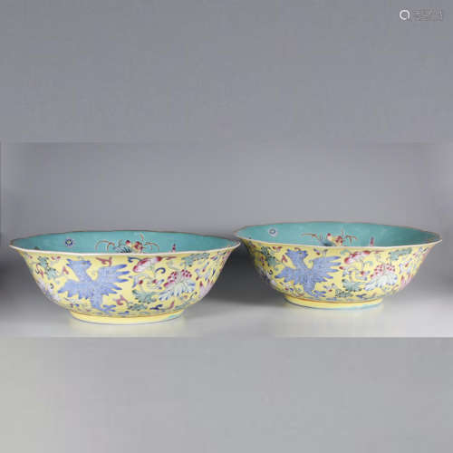 A PAIR OF YELLOW GROUND FAMILLE ROSE FLOWER AND BIRD PORCELAIN BOWLS