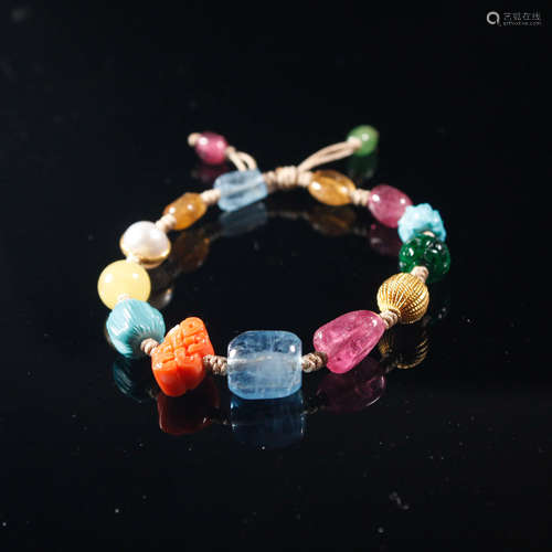 A MULTI JEWELED BEADS BRACELET