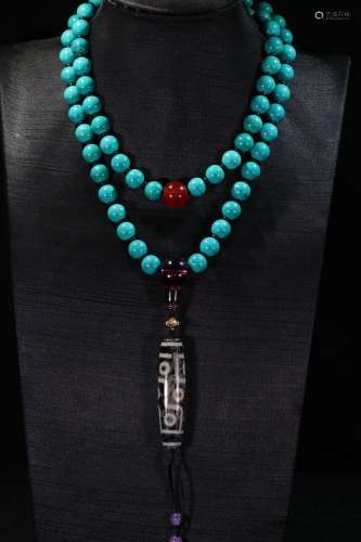 A 9-Eye Dzi Turquoise Stone Necklace