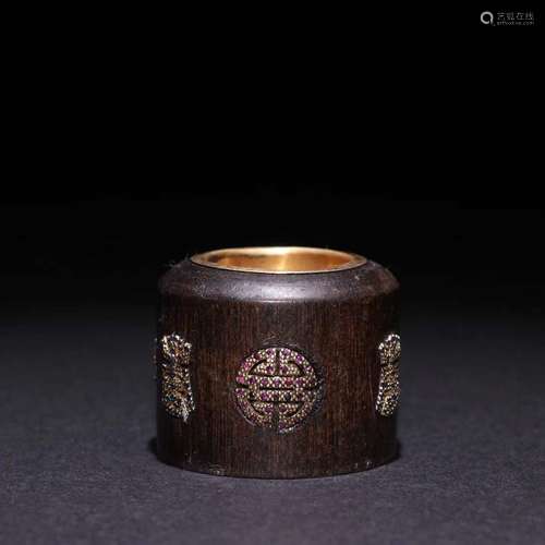 An Agarwood Gilt Siver Longevous Pattern Ring