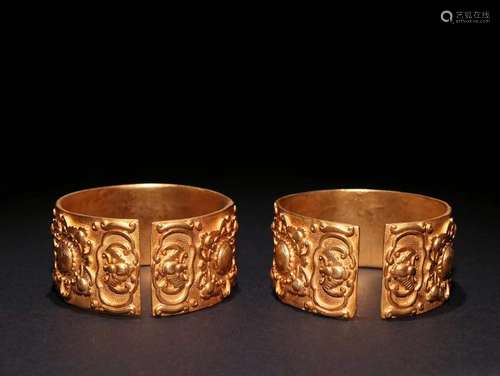 Pair Of Gilt Bronze Story Carved Bangles