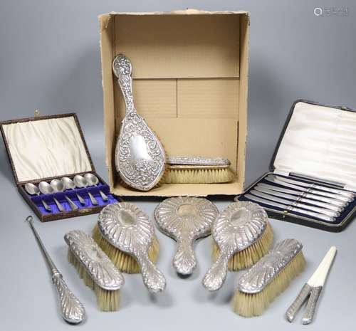 A late Victorian repousse silver mounted seven piece dressing table set by William Comyns, London,