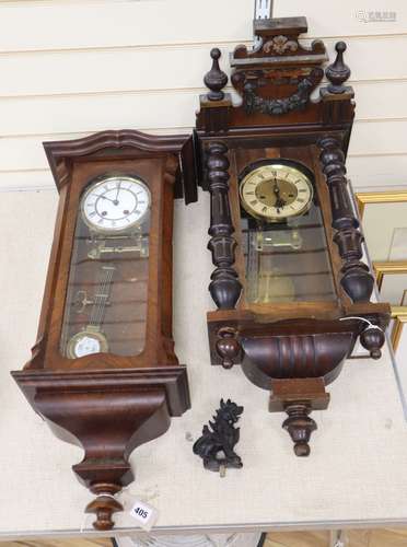 A walnut Vienna regulator with enamelled Roman dial and another regulator with carved pediment,