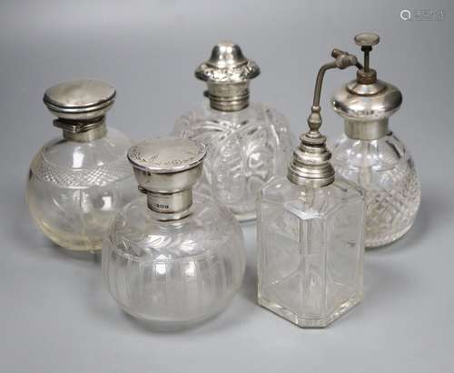 Two silver mounted glass atomisers and three silver mounted glass scent bottles, tallest overall