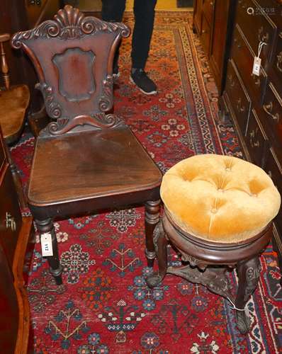 A Victorian carved mahogany hall chair and a Victorian carved rosewood adjustable music stool (2)