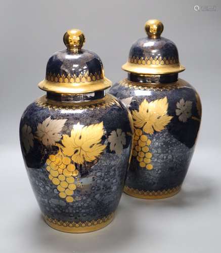 A pair of Artlynsa lustre and gilt decorated vases, height 43cmCONDITION: One vase neck rim