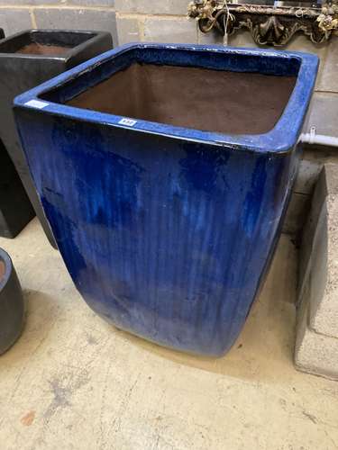 A large blue glazed square garden planter, width 63cm height 90cm