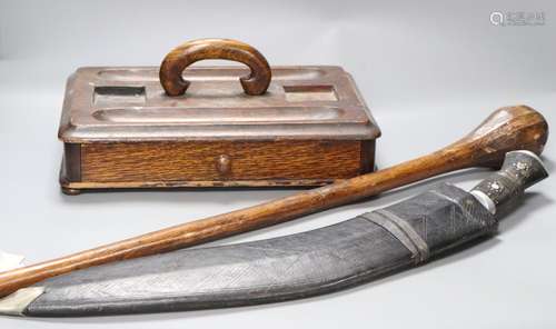 A kukri, an oak inkstand and a tribal throwing club