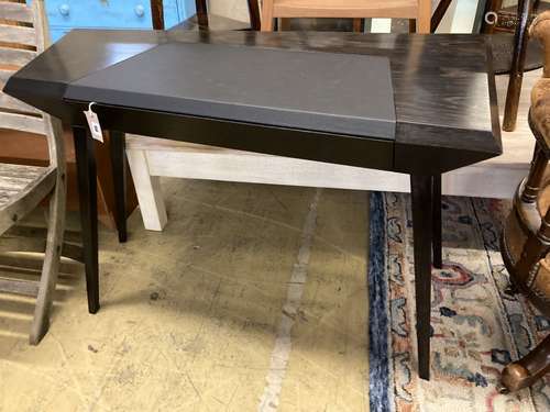 A Christopher Coane design onyx black oak desk, with copper lined push opening drawer, width