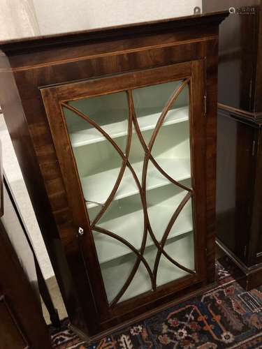 A George III mahogany hanging corner cupboard with glazed door, width 74cm, depth 39cm, height