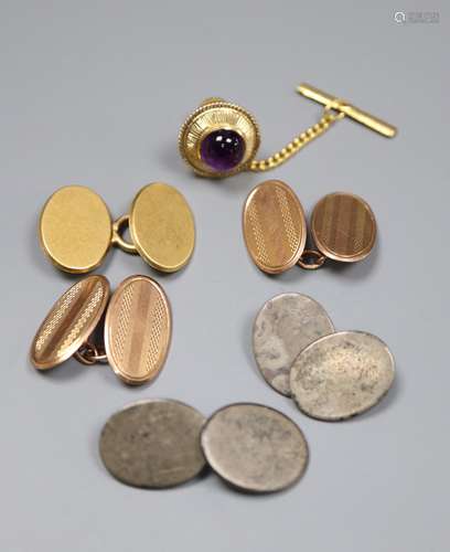 A pair of 9ct gold cufflinks, 5.4 grams, an 18ct cufflink, 5.7 grams, a 14k and amethyst dress stud,